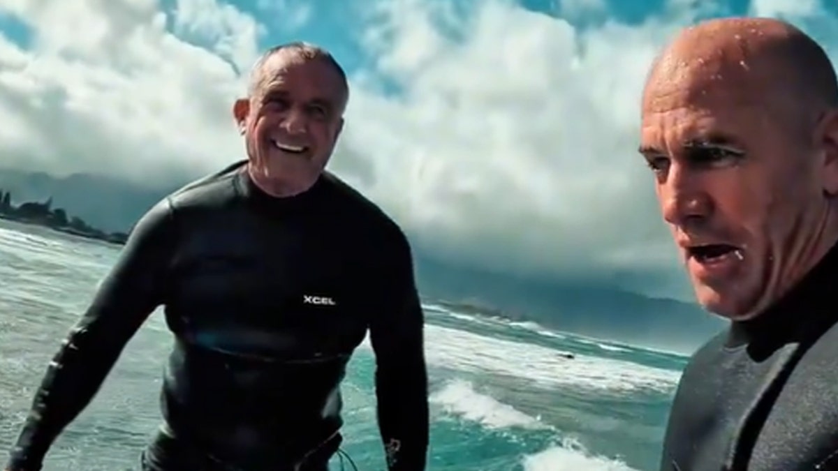 RFK Jr and Kelly Slater surfing