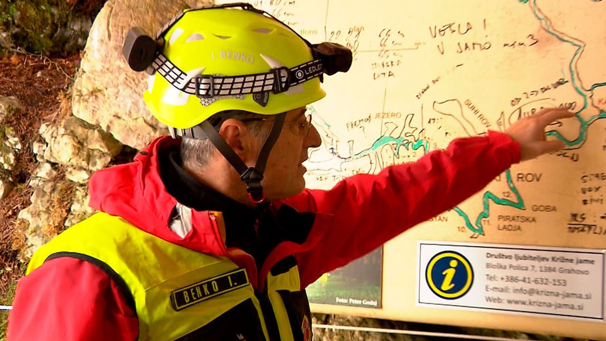Rescuer inspects map
