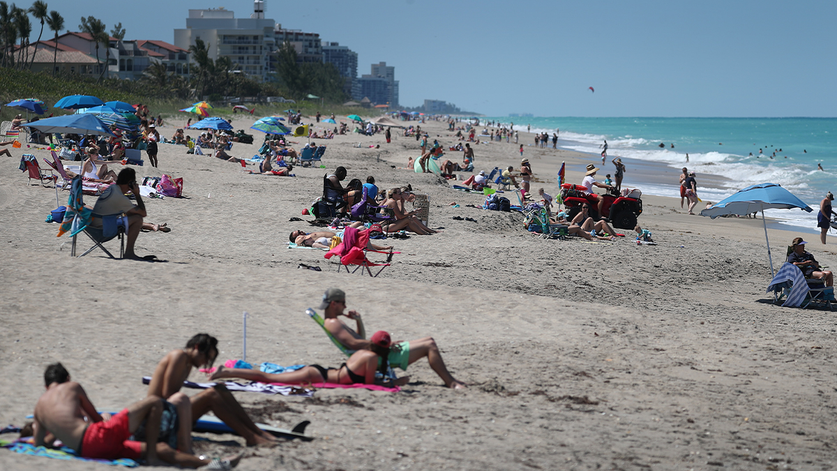 Sunbathers at a beach in Jensen Beach, Florida