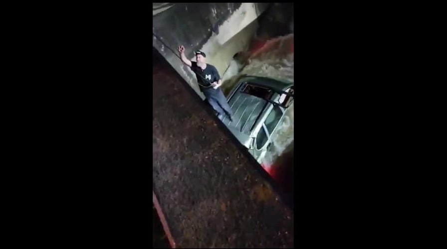  Texas driver rescued from floodwaters after standing on roof of SUV