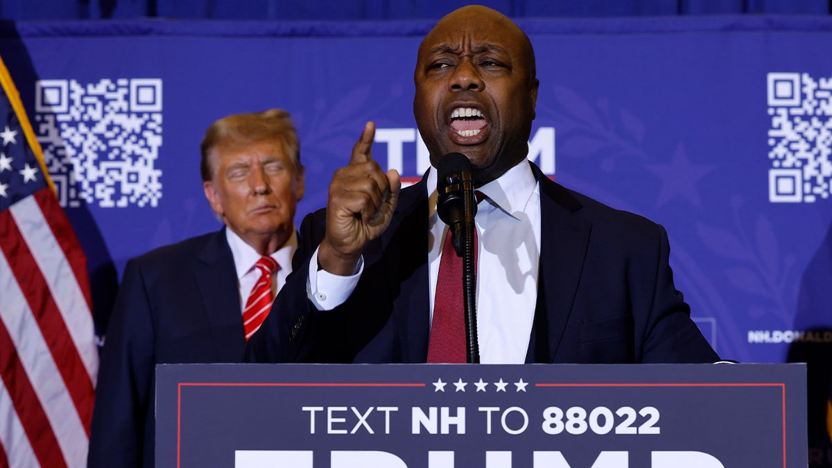 Tim Scott speaking at an event with Trump