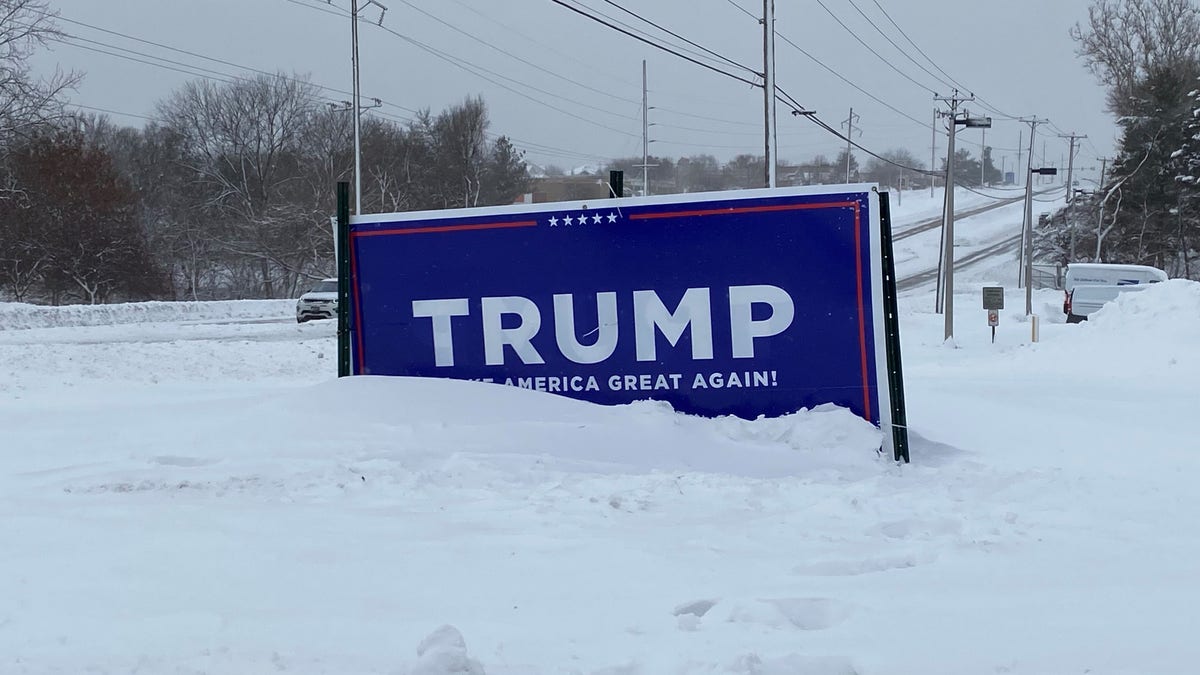 Trump campaign sign covered by snow