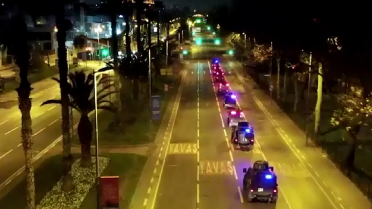 Turkey police vehicles drive down road
