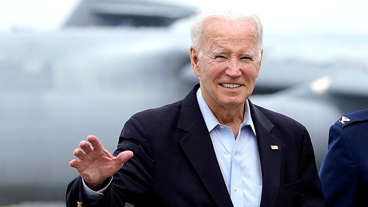President Joe Biden waves to members of the media as he heads to NATO Summit in Europe.