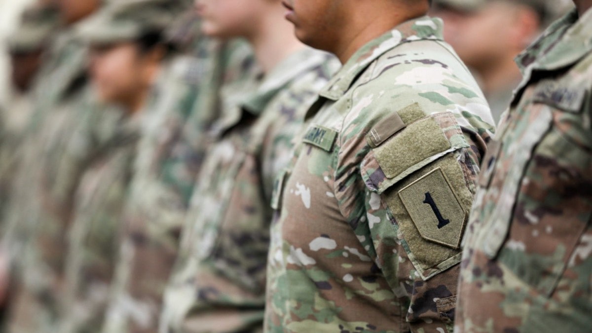 Army national guard soldiers stand at attention