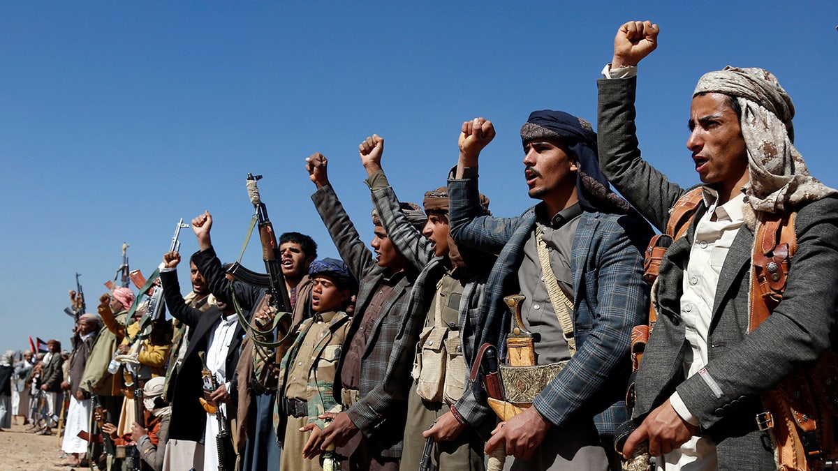 Houthis raise fists