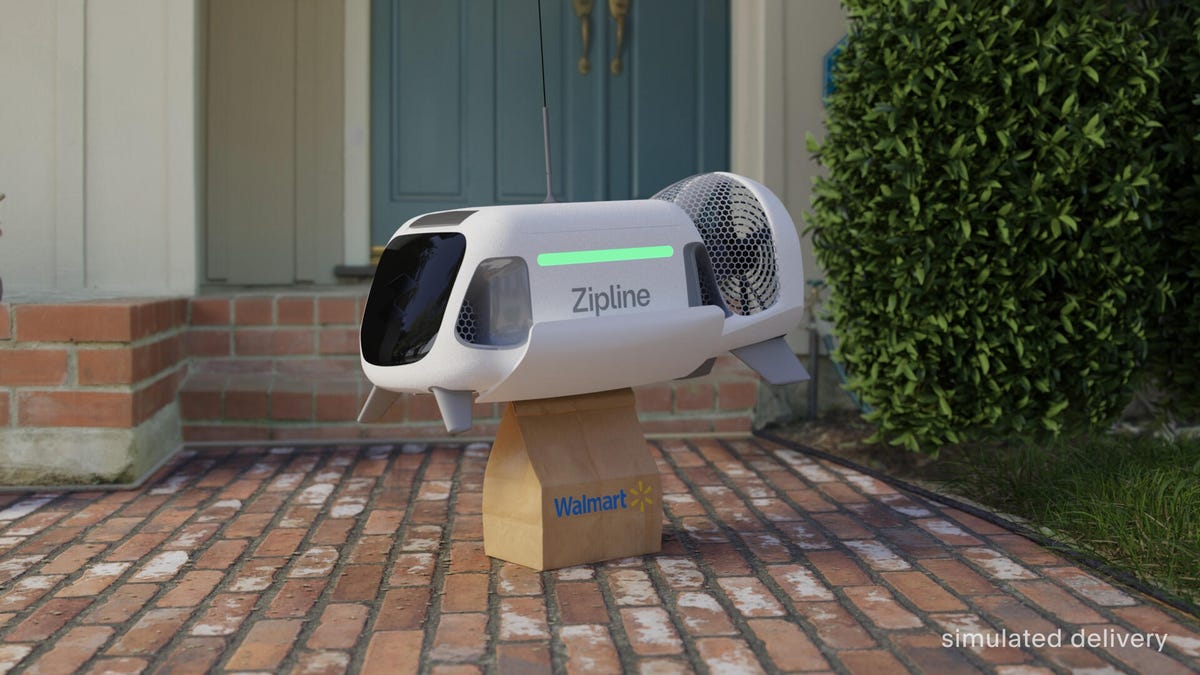 A Zipline drone delivery system lands a package on a brick walkway