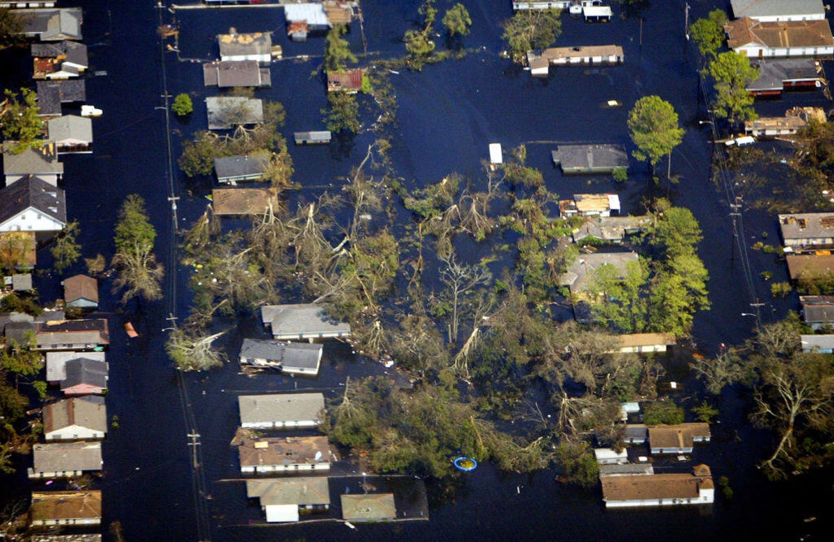 Aerial shot of houses surrounded by flood water.
