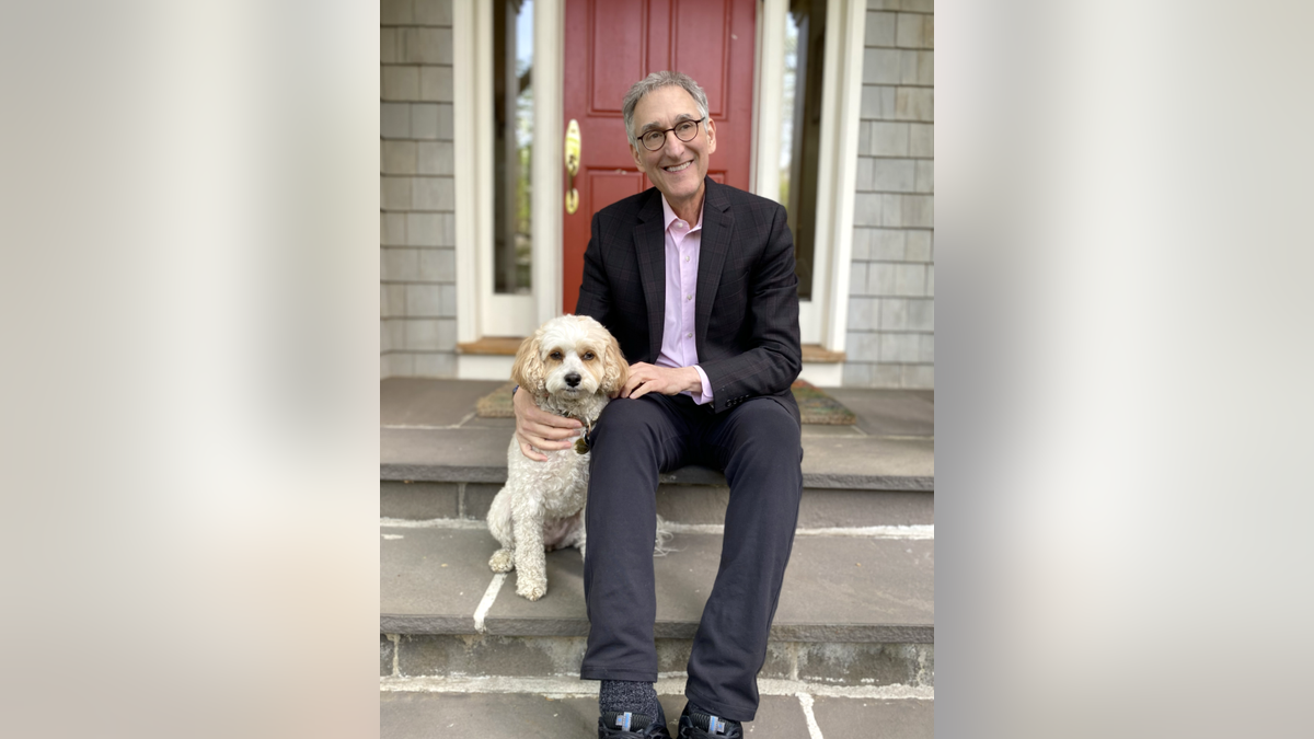 Dr. Steven Hassan pictured with his dog