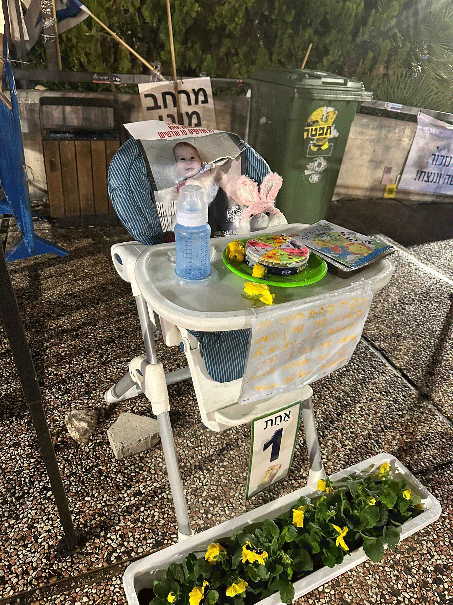 Kfir Bibas photo on a high chair