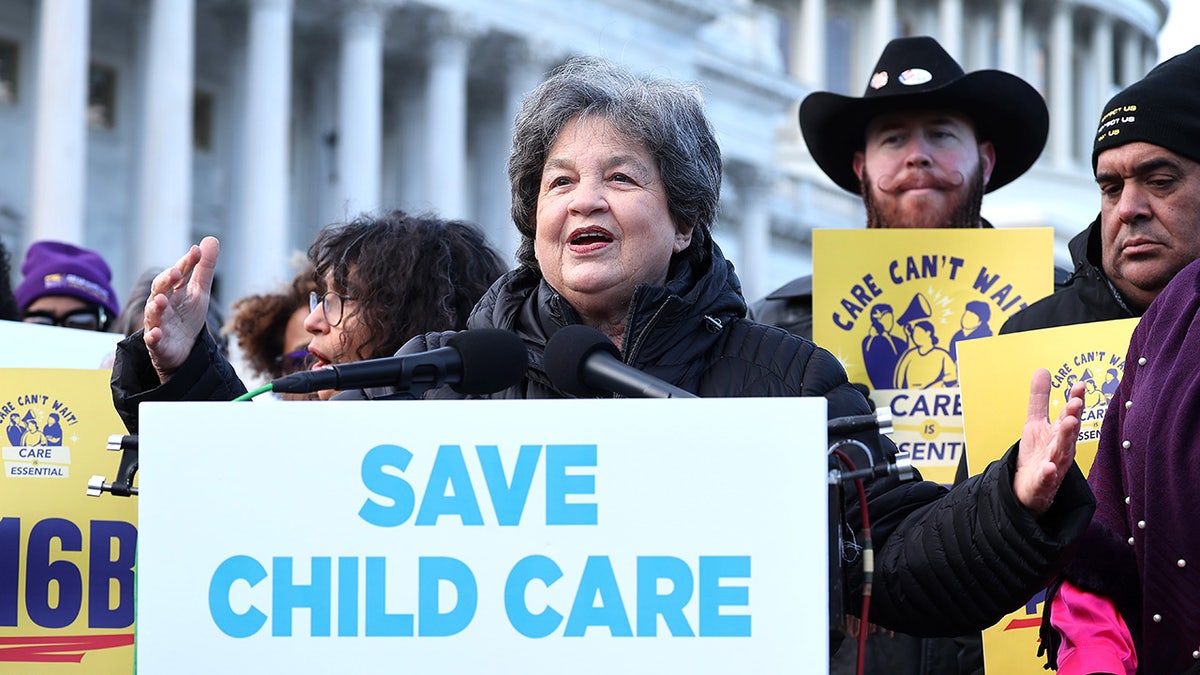 Frankel on Capitol Hill with Save Child Care sign