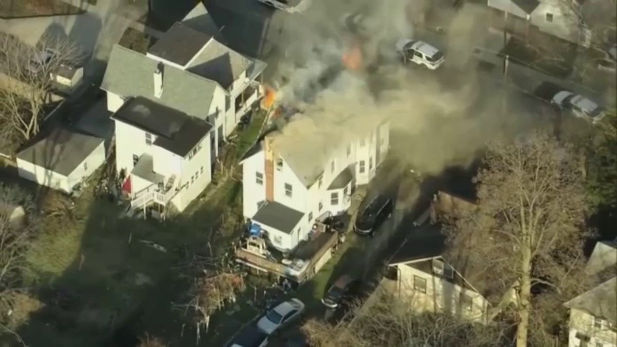 Aerial footage of home on fire
