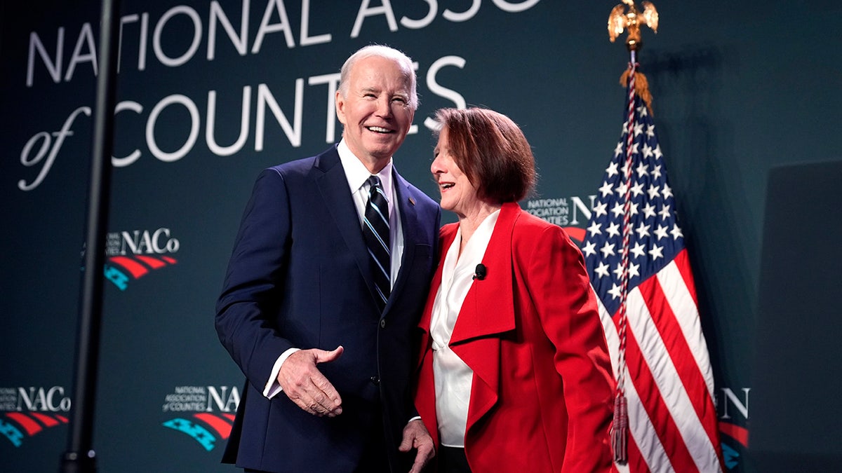 Biden with NatCo president and commissioner in Ramsey County, Minn., Mary Jo McGuire