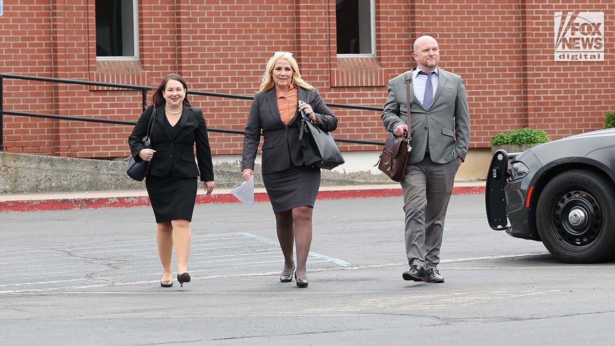 Defense attorneys Elissa Massoth, Anne Taylor and Jay Logsdon depart the courthouse