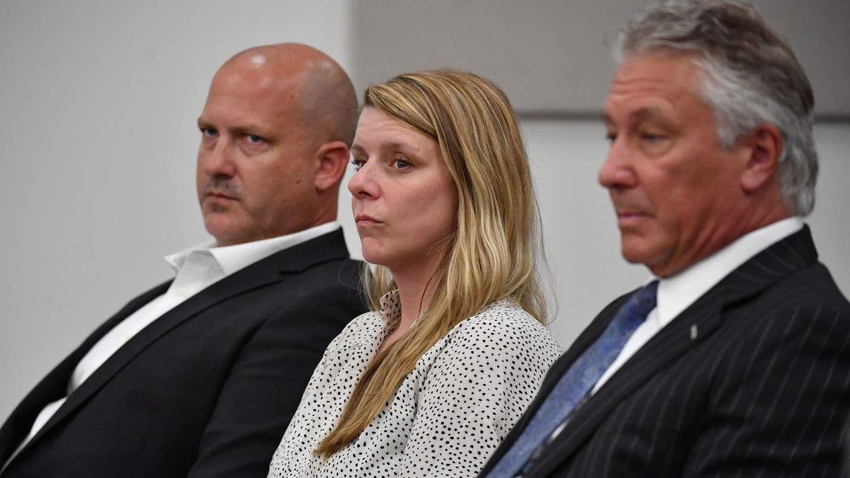Gabby Petitos parents, Joseph Petito, left, and Nichole Schmidt, center, with their attorney, Patrick Reilly, in court