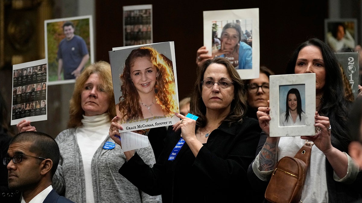 Families hold up photos of teens who died due to social media