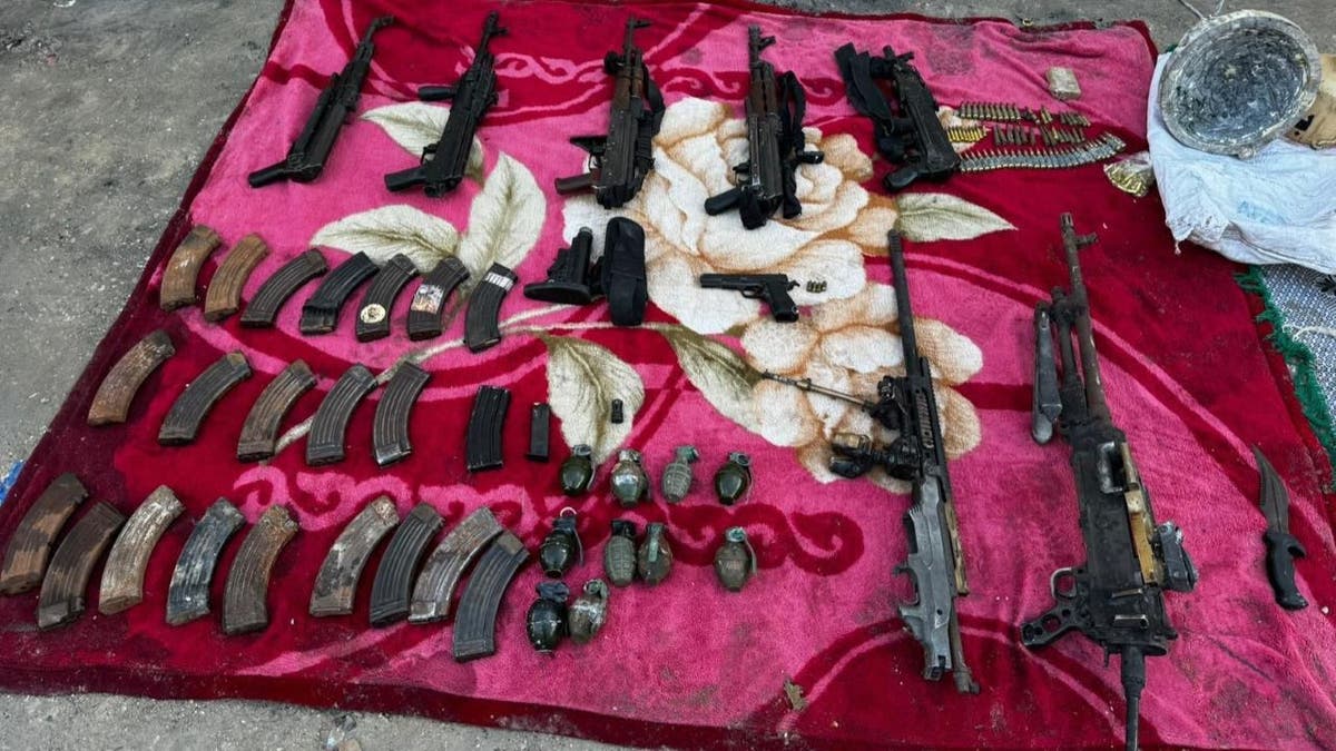 Several Hamas firearms sprawled out on blanket