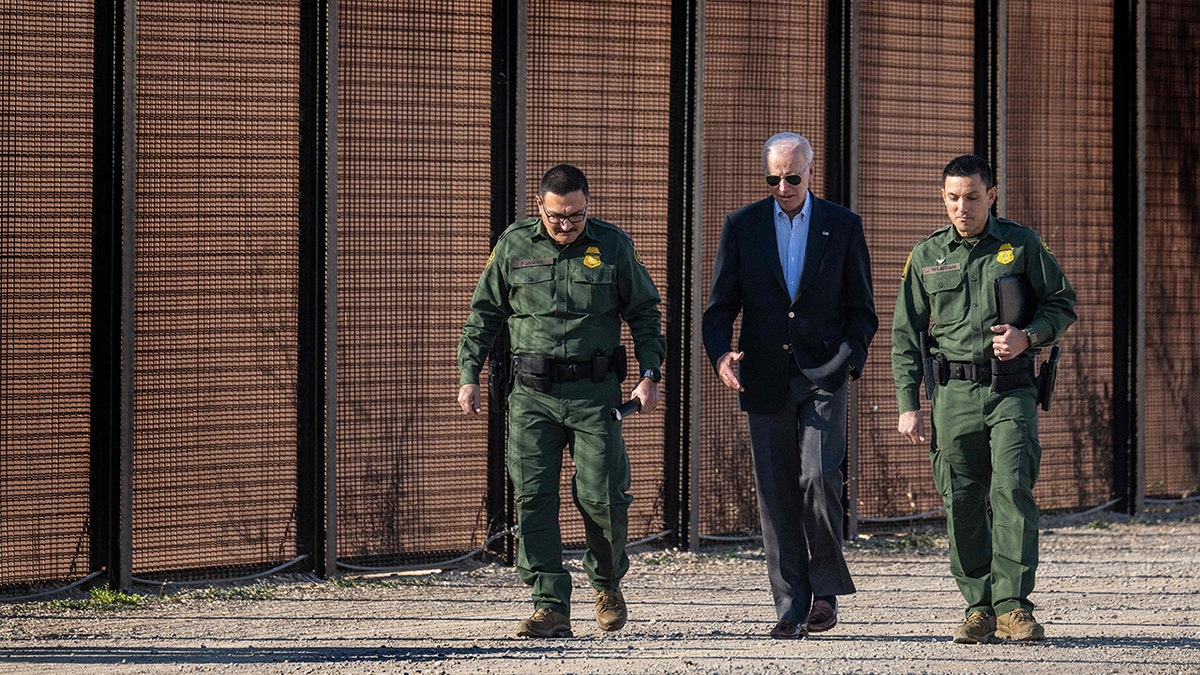 Joe Biden walking with border officials