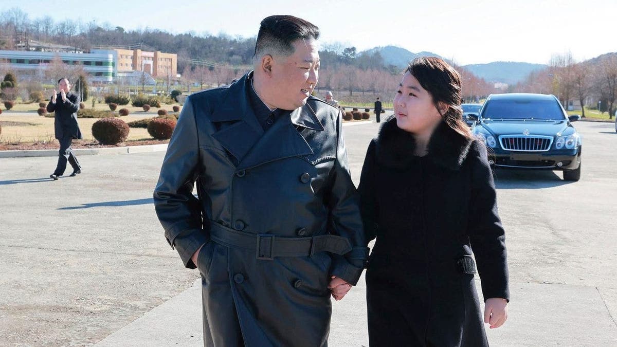 North Korean leader Kim Jong Un, left, and his daughter