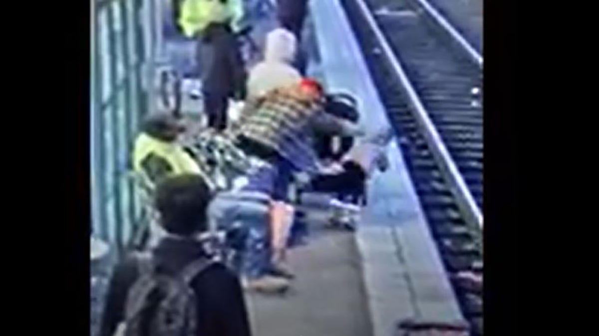 suspect shoving child onto tracks
