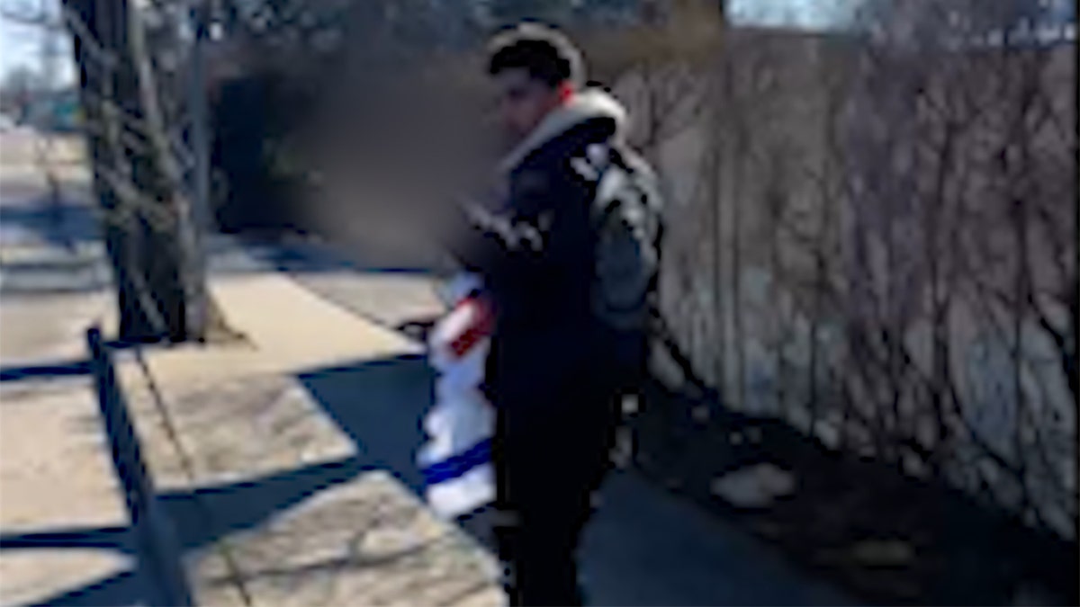Bechir Lehbeib gives middle finger while walking with stolen flag
