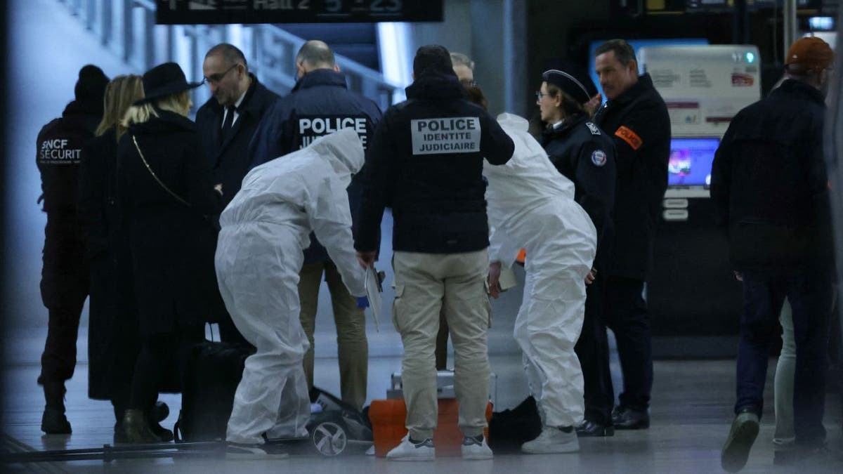 French forensic and judicial police collect evidence after a knife attack