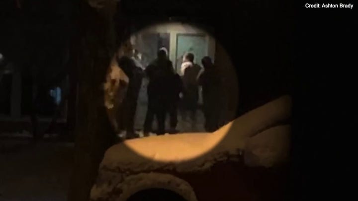 Jordan Willis is detained on a porch in video captured by a neighbor Jan. 9