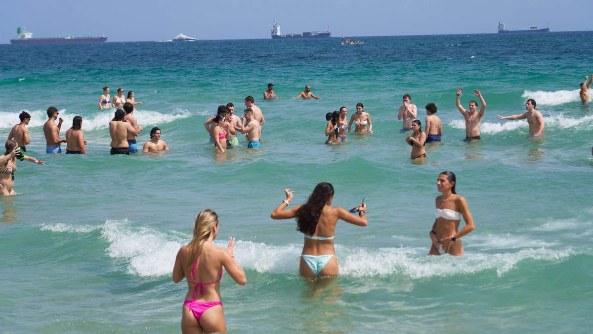Spring break party seekers took Fort Lauderdale's welcome message as crowds flocked to the beach.