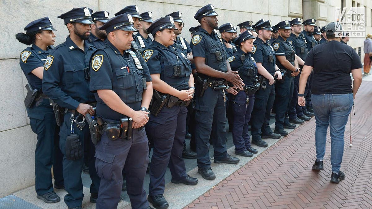 NYPD officers line up outside Columbia University