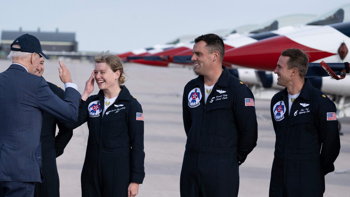 US President Joe Biden greets United States Air Force Thunderbirds pilots at Peterson Space Force Base in Colorado Springs, Colorado, on May 31, 2023.