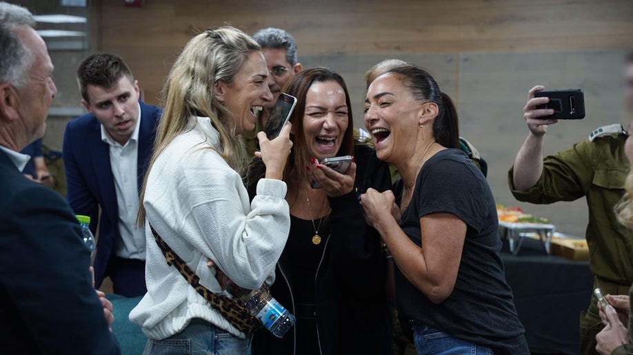 Yael Alexander speaks to her son over the phone following his release.