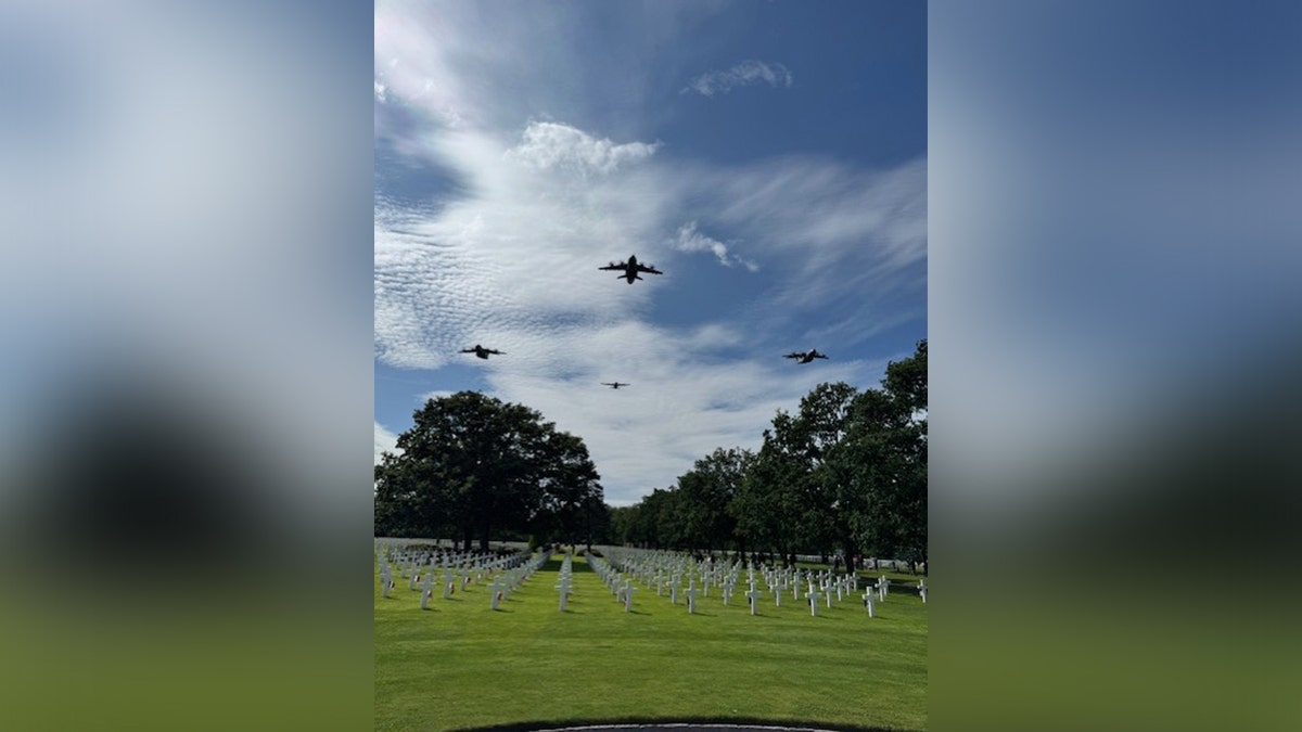 Planes flying over an American cemetery