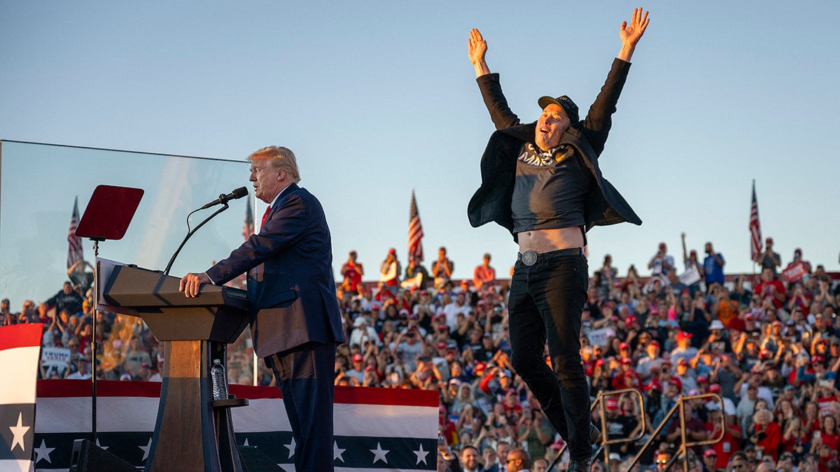 Musk leaping on stage while Trump talks