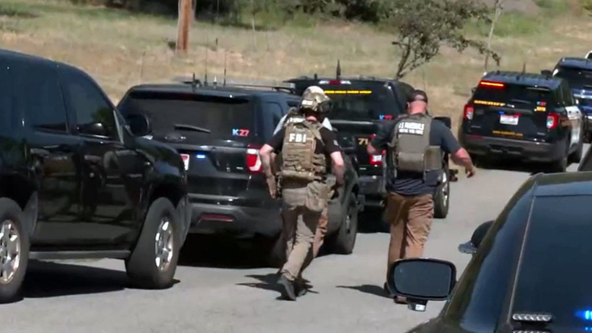 Police officers walking at active shooting scene in Idaho