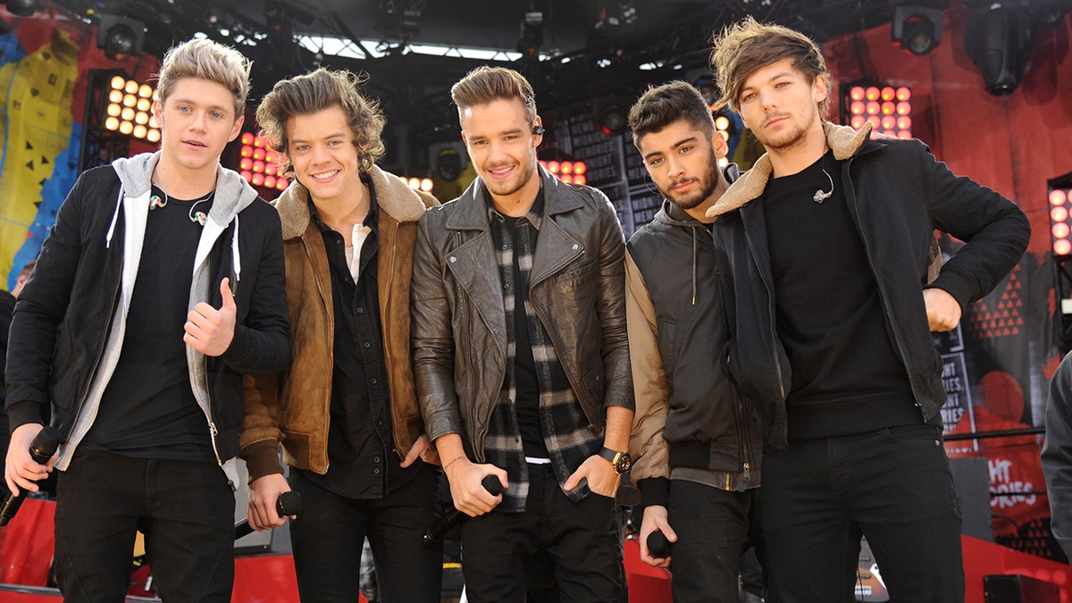 One Direction performs on stage.