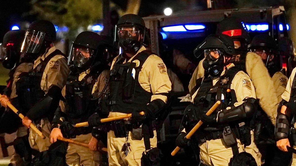 Arizona police in Phoenix wearing riot gear outside Capitol building