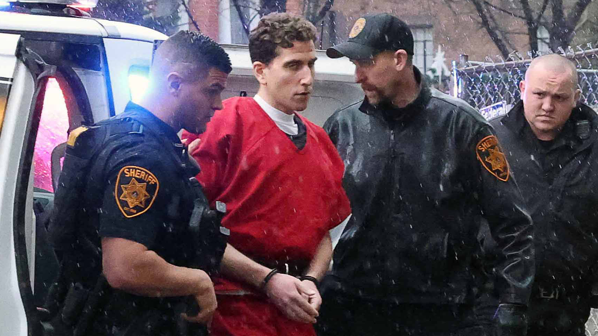 kohberger extradition arrival, shackles, red jumpsuit, escorted by deputies
