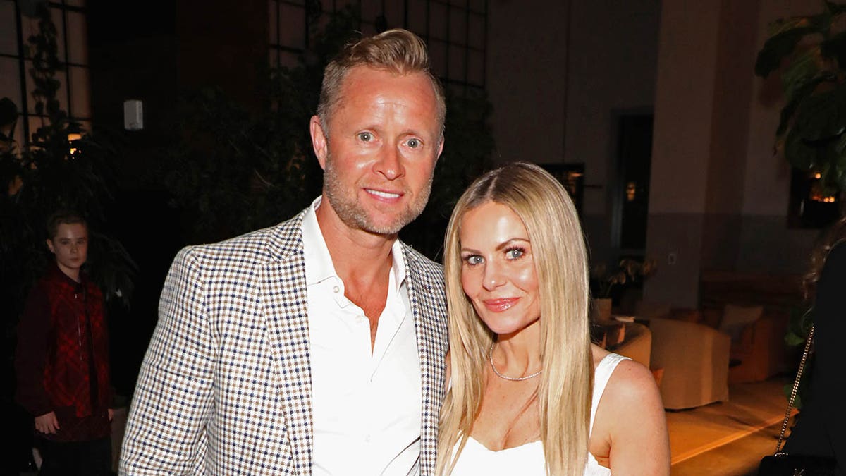 candace cameron bure posing with her husband valeri bure 