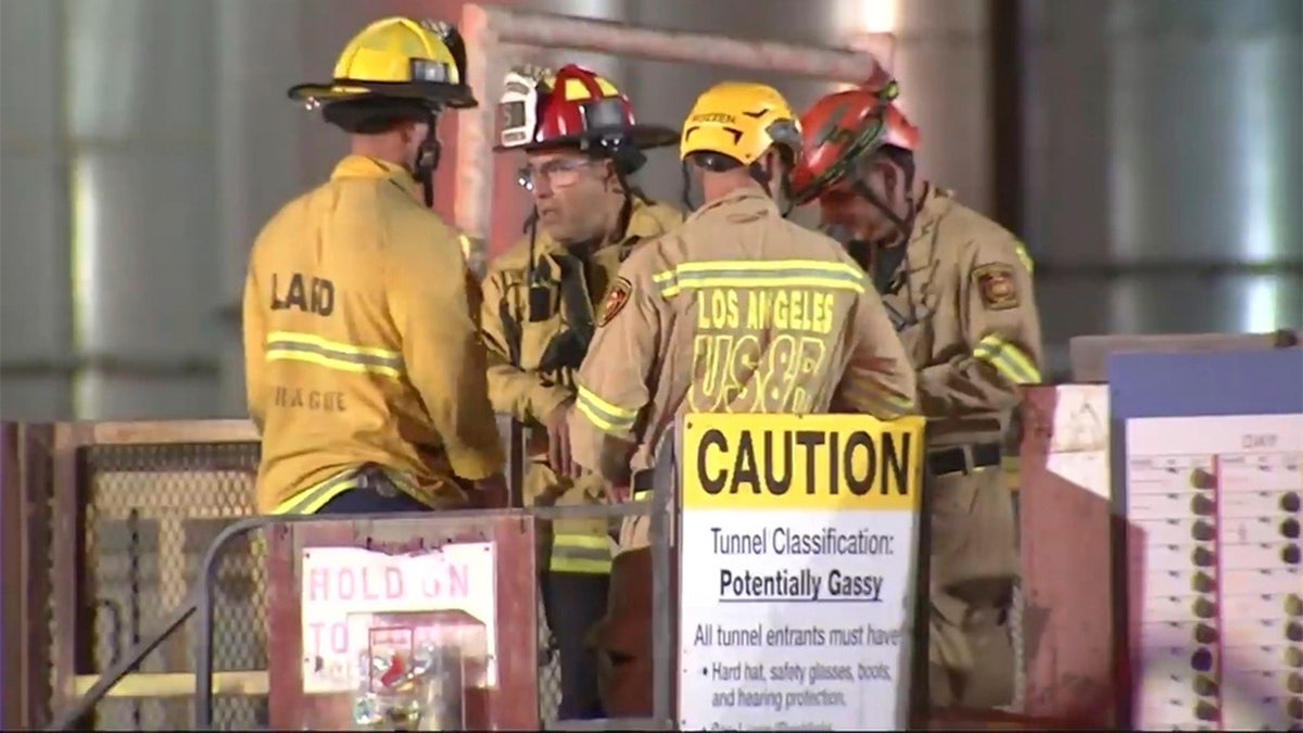 This image taken from footage provided by KABC/ABC7 Los Angeles shows first responders working the scene after a tunnel collapsed on Wednesday, July 9, 2025, in Los Angeles.
