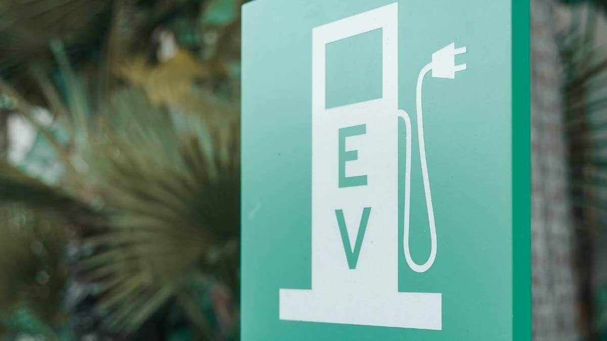 EV sign at a fast charging station.