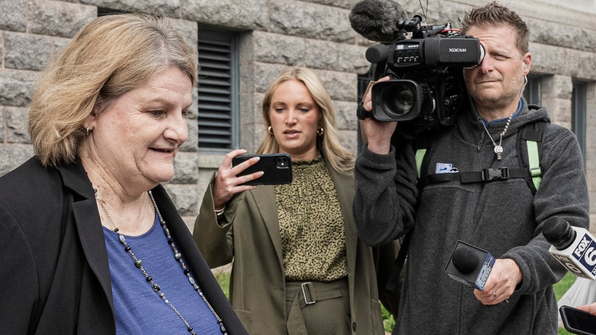 Milwaukee County Circuit Judge Hannah Dugan outside of court with the media surrounding her