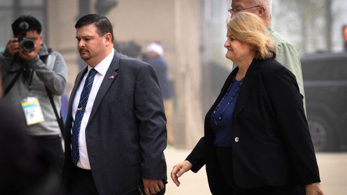 Hannah Dugan walks into courthouse