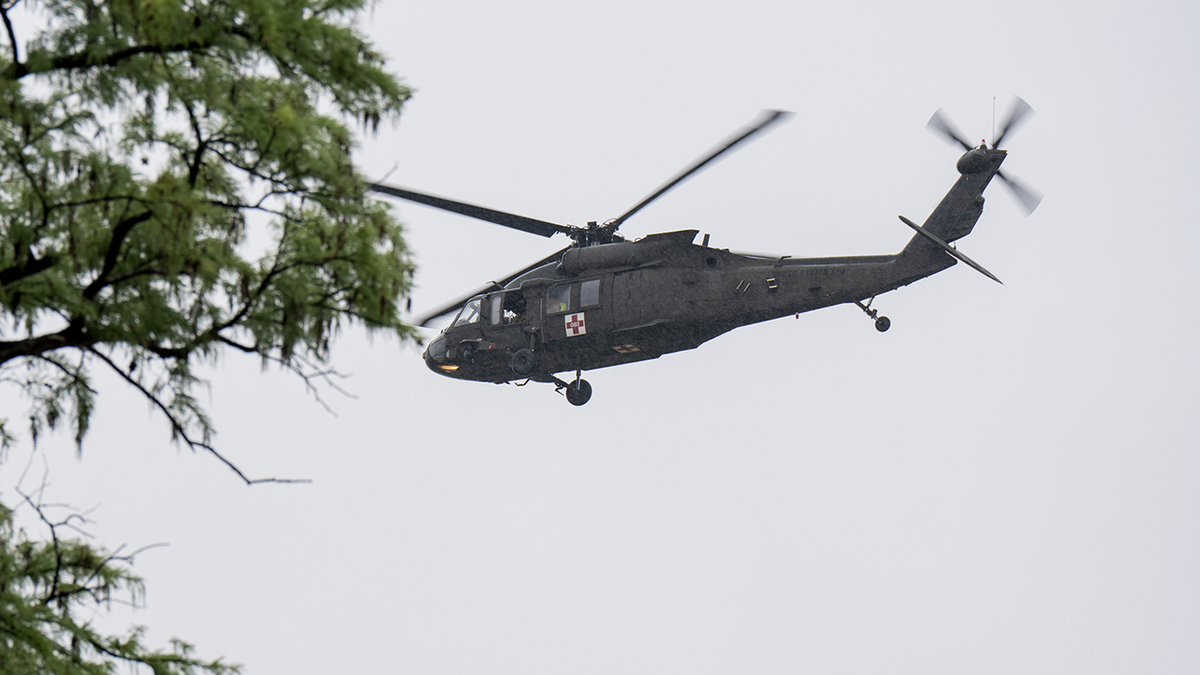 A UH-60 Black Hawk helicopter conducts rescue operations along the Guadalupe River on July 4, 2025 in Kerrville, Texas.
