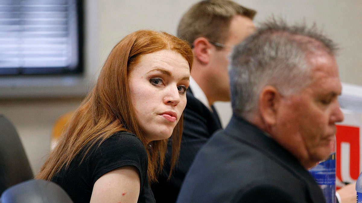 Shannon Price looking ahead with a black shirt.