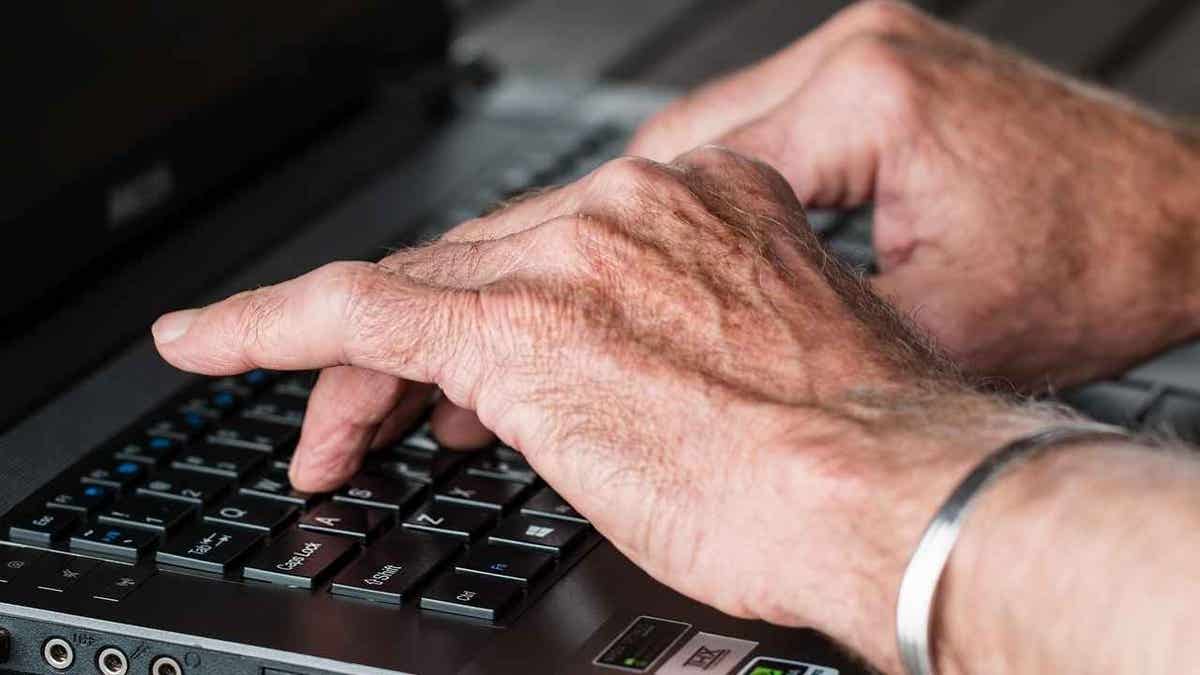 A man typing on his keyboard.