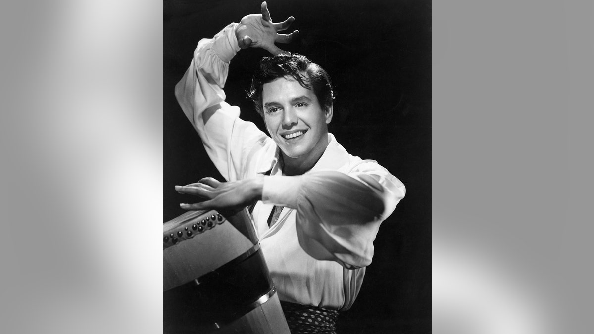 Desi Arnaz playing the drums.