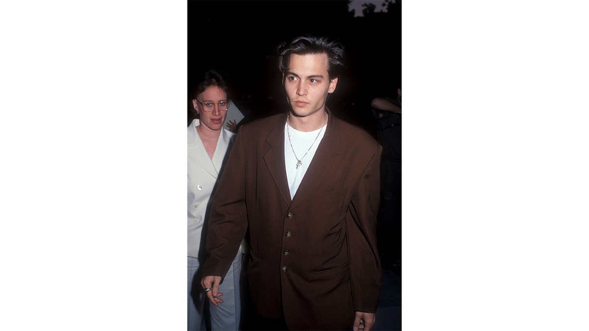 Johnny Depp attends a "21 Jump Street" screening
