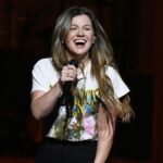 Kelly Clarkson celebrates comeback with tequila shot from fan, says she ‘cried’ over canceled show