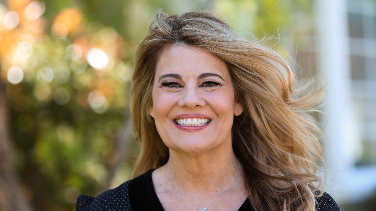 A close-up of Lisa Whelchel smiling