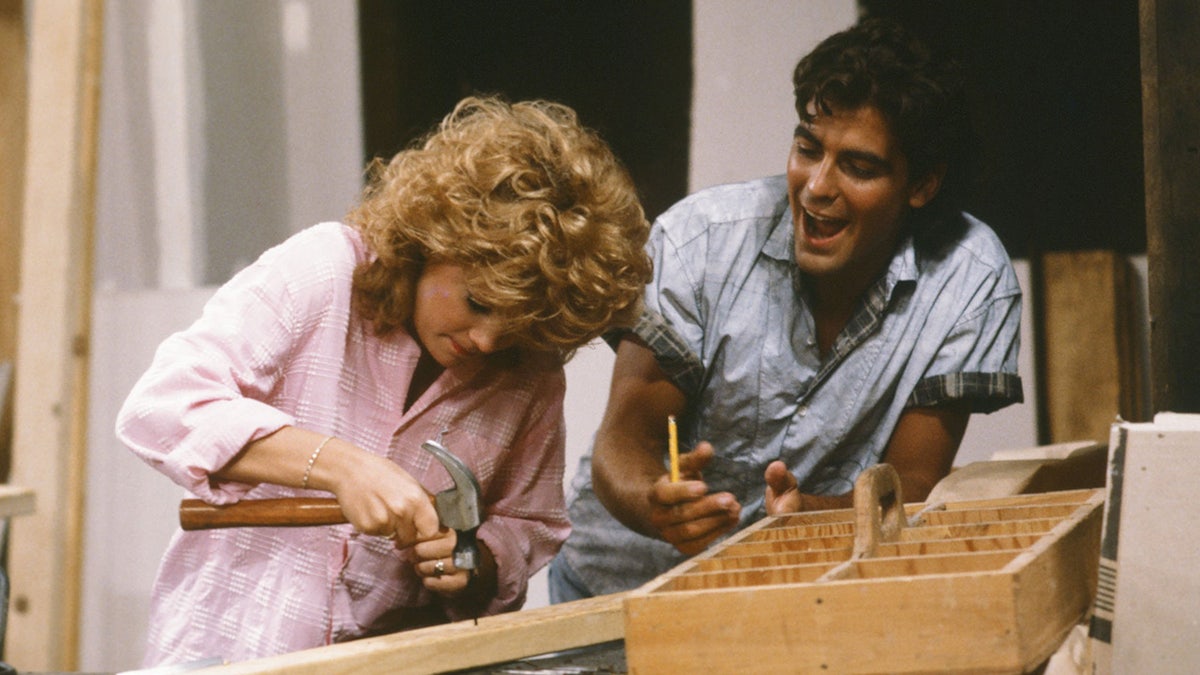 George Clooney joking around with Lisa Whelchel on set.